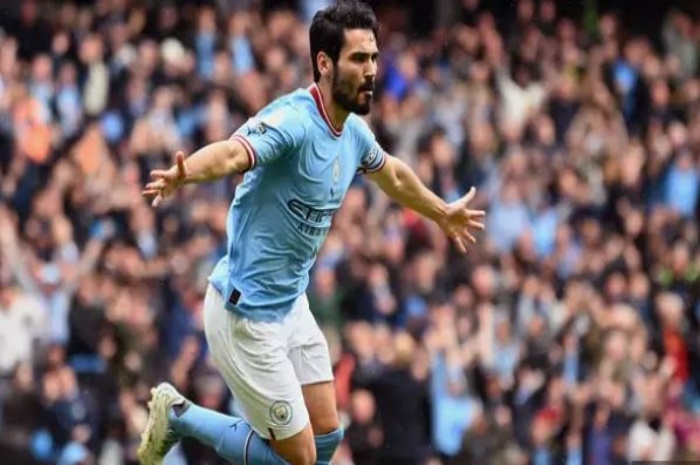 Ilkay Gundogan berhasil mencetak dua gol ke gawang Manchester United. Gol itu membuat Man City mengangkat trofi Piala FA setelah menang 2-1 di Wembley. - Image