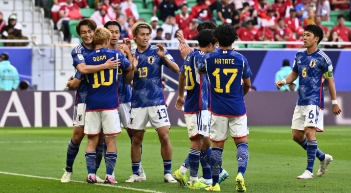 Pemain Jepang saat merayakan gol ke gawang Indonesia. (AFC) - Image