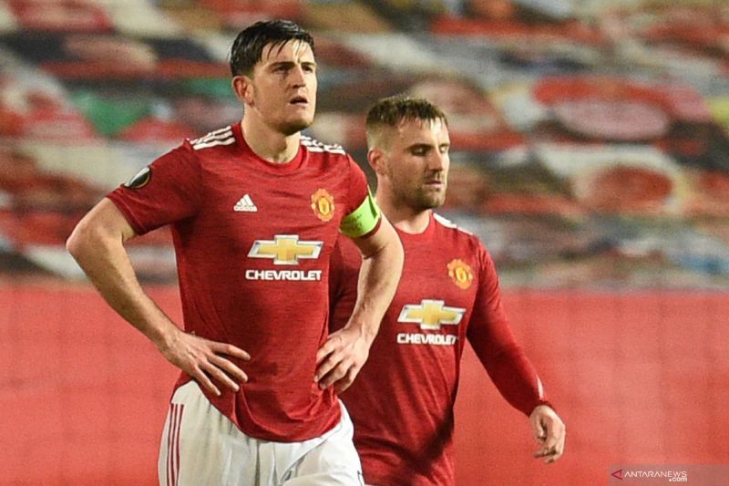Bek Manchester United Harry Maguire (kiri). (AFP/OLI SCARFF) - Image