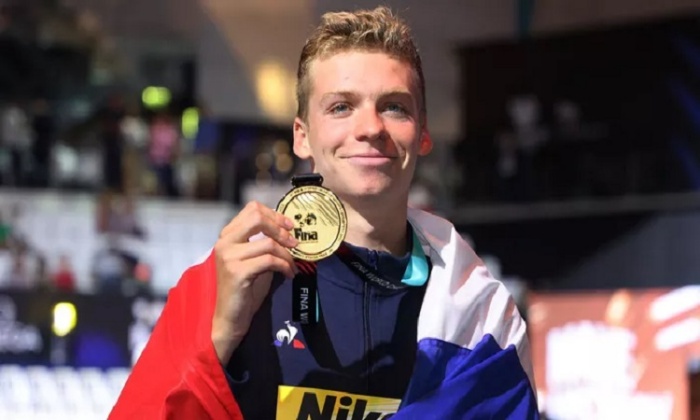 Leon Marchand kembali meraih medali emas di kandang sendiri sekaligus memecahkan rekor Olimpiade. (Reuters) - Image
