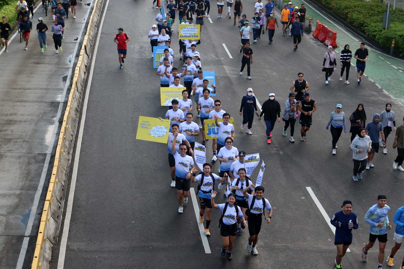 Kampanye Judi Pasti Rugi kepada masyarakat yang beraktivitas di CFD Jakarta, Minggu (6/7/2025). (Der