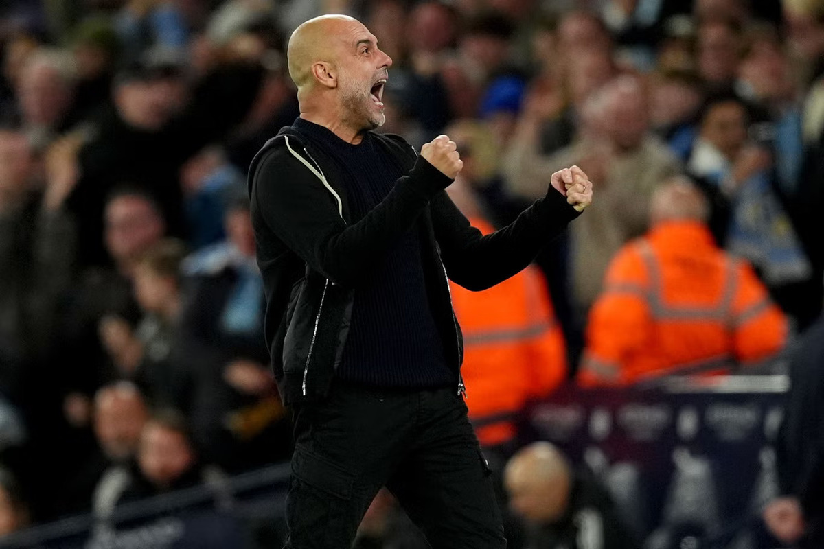 Selebrasi Pep Guardiola atas kemenangan Manchester City. (Martin Rickett/PA) - Image