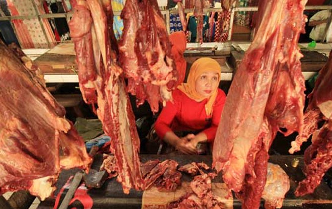 Ilustrasi pedagang daging sapi. (Jawa Pos Photo)