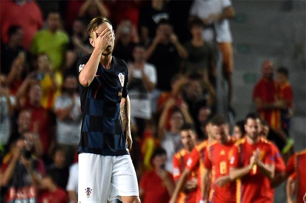 Ekspresi kekecewaan Ivan Rakitic saat timnya dikalahkan oleh Spanyol - Image