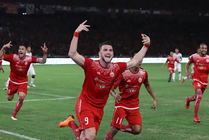 Marko Simic melakukan selebrasi usai membobol gawang Bali United di final Piala Presiden 2018. - Image