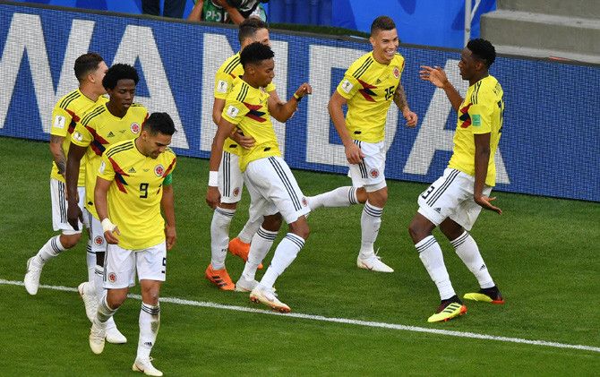 Kolombia berhasil meraih tiket 16-besar dan sukses menjadi juara Grup H - Image