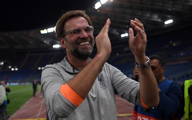 Saking gembiranya Jurgen Klopp sampai lupa dengan skor akhir melawan AS Roma. - Image