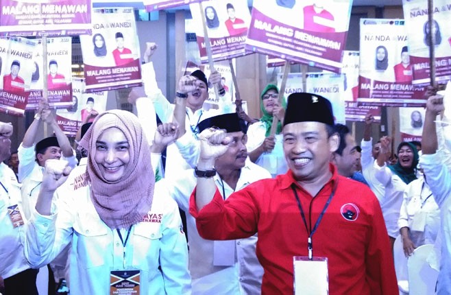 TERSANGKA: Pasangan Nanda dan Wanedi, cawali dan cawawali Kota Malang 2018. - Image