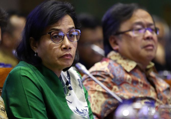 Menteri Keuangan Sri Mulyani saat rapat kerja dengan komisi XI DPR di Gedung Nusantara I. - Image