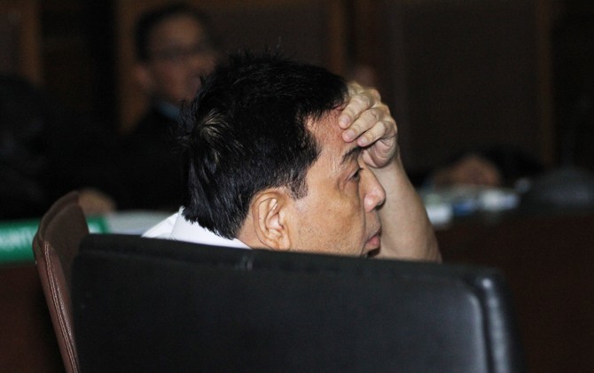 Setya Novanto saat duduk di kursi pesakitan dalam sidang perkara kasus dugaan korupsi e-KTP yang melilitnya, di PN Tipikor Jakarta - Image