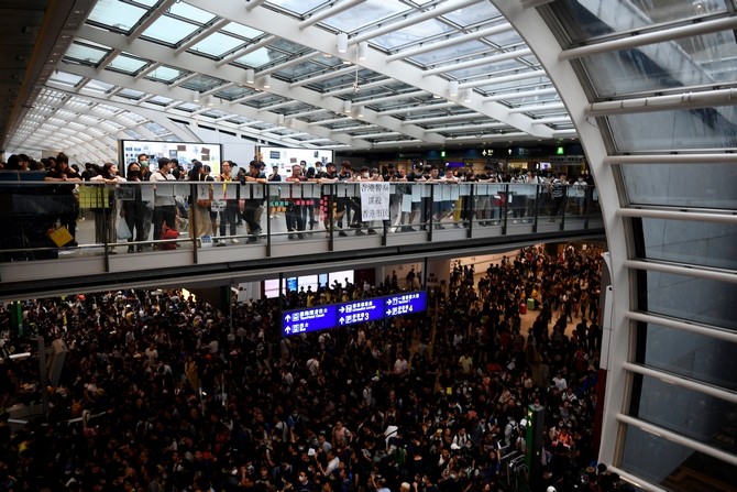 Pro-democracy protesters gather during a demonstration against police brutality and the controversial extradition bill at Hong Kong - Image