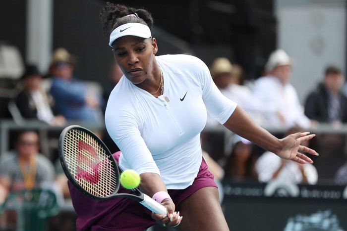 Serena Williams of the US hits a return against Camila Giorgi of Italy during their women - Image
