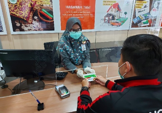 Ilustrasi layanan teller nasabah Bank BNI Syariah. - Image