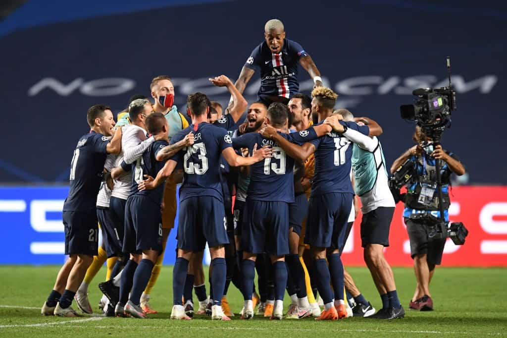 Paris Saint-Germain players celebrate their win at the end of the UEFA Champions League semi-final football match between Leipzig and Paris Saint-Germain at the Luz stadium, in Lisbon on August 18, 2020. (Photo by David Ramos / POOL / AFP) - Image