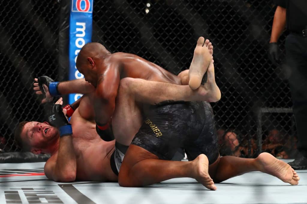 ANAHEIM, CALIFORNIA - AUGUST 17: Stipe Miocic and Daniel Cormier fight from the floor in the first round during their UFC Heavyweight Title Bout at UFC 241 at Honda Center on August 17, 2019 in Anaheim, California. Joe Scarnici/Getty Images/AFP - Image