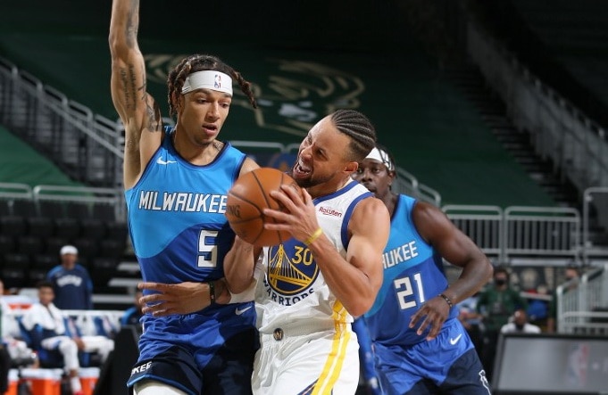 MILWAUKEE, WI - DECEMBER 25: Stephen Curry #30 of the Golden State Warriors handles the ball during the game against the Milwaukee Bucks on December 25, 2020 at the Fiserv Forum Center in Milwaukee, Wisconsin. NOTE TO USER: User expressly acknowledges and - Image