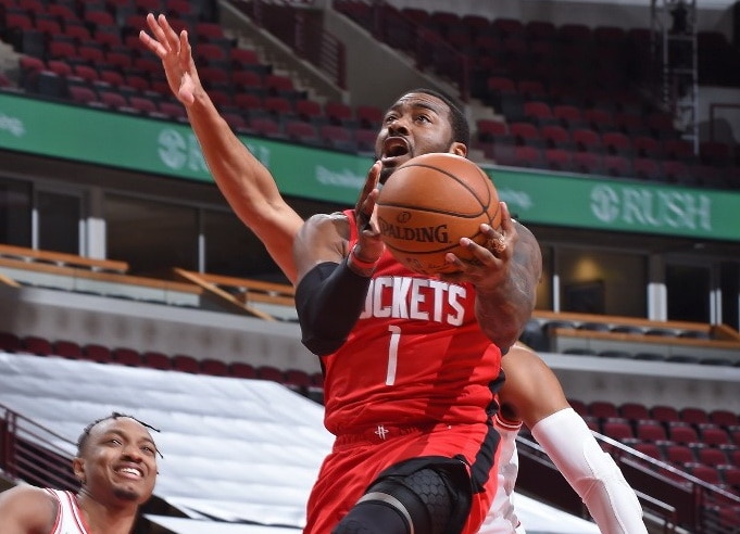 CHICAGO, IL - DECEMBER 11: John Wall #1 of the Houston Rockets drives to the basket against the Chicago Bulls during a preseason game at the United Center on December 11, 2020 in Chicago, Illinois. NOTE TO USER: User expressly acknowledges and agrees that - Image