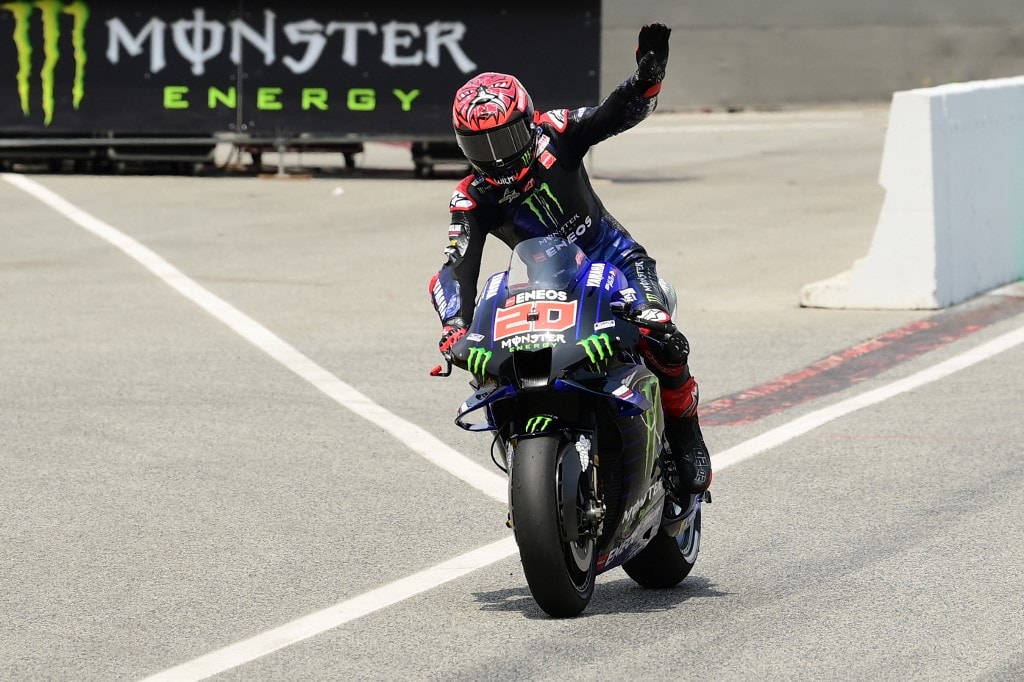 Yamaha French rider Fabio Quartararo celebrates getting pole position during the MotoGP qualifying session ahead of the Moto Grand Prix de Catalunya at the Circuit de Catalunya on June 5, 2021 in Montmelo on the outskirts of Barcelona. (Photo by LLUIS GEN - Image