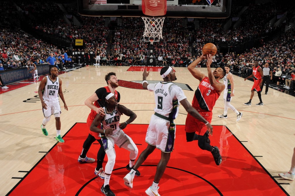 PORTLAND, OR - FEBRUARY 5: CJ McCollum #3 of the Portland Trail Blazers drives to the basket during the game against the Milwaukee Bucks on February 5, 2022 at the Moda Center Arena in Portland, Oregon. NOTE TO USER: User expressly acknowledges and agrees - Image