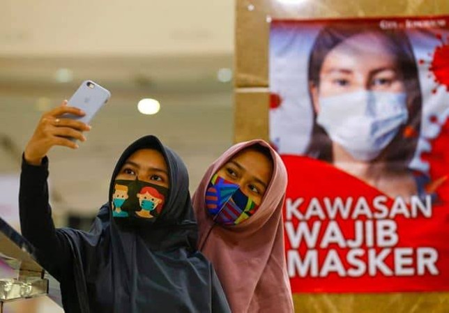 Ilustrasi warga menggunakan masker. Dok. JawaPos - Image