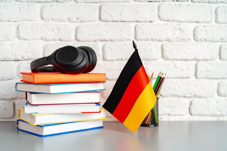 Ilustrasi buku dan bendera Jerman (Dok. Freepik)